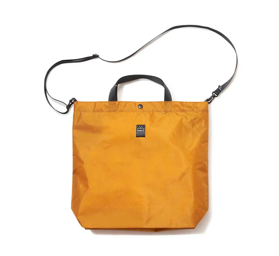 omcc japan, omcc uk stockist, omcc uk, nylon, reusable bag, found bath, found bath uk stockist, Ocean × Mountain × City × Creation, ocean mountain city creation, medium Packable Tote Bag golden
